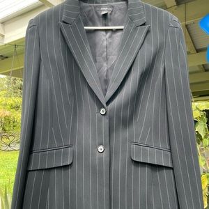 Black pinstripe lined collard blazer, button accent at sleeves.